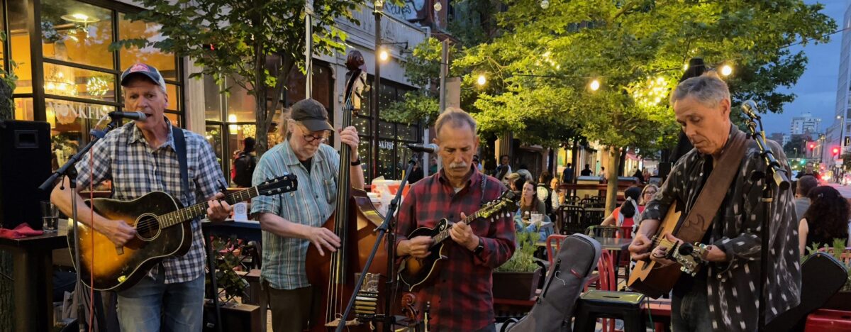 The Mass Avenaires playing outdoors on the patio at the Phoenix Landing at dusk